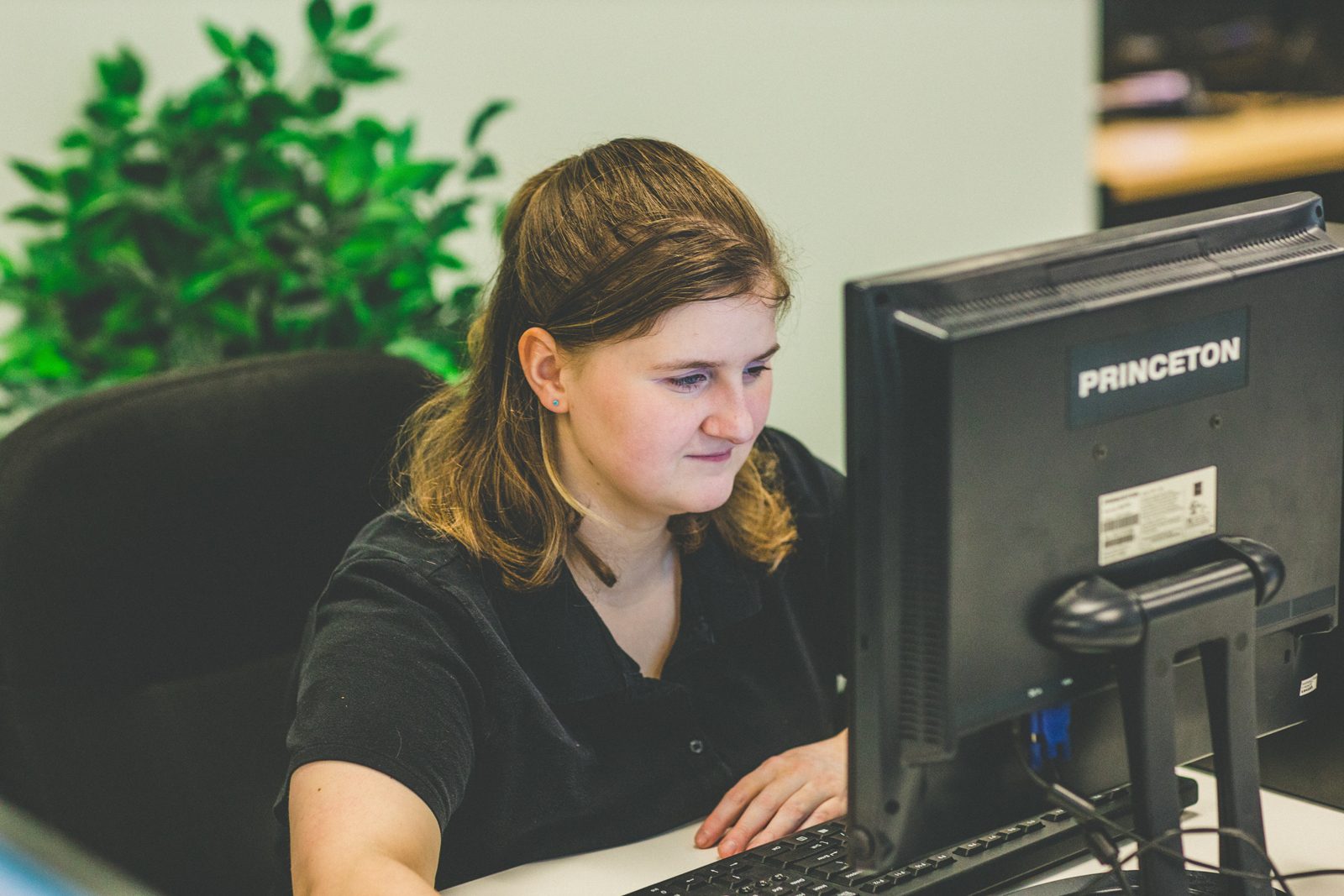 QualityLogic team member working at her desk